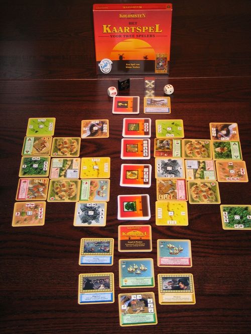 Обложка игры De Kolonisten van Catan: Het Kaartspel; Goud & Piraten